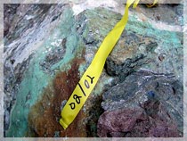 Heavy malachite staining indicating copper mineralization