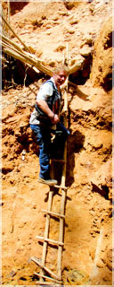 Len descending into Gyama local hard rock mining site / Gblita